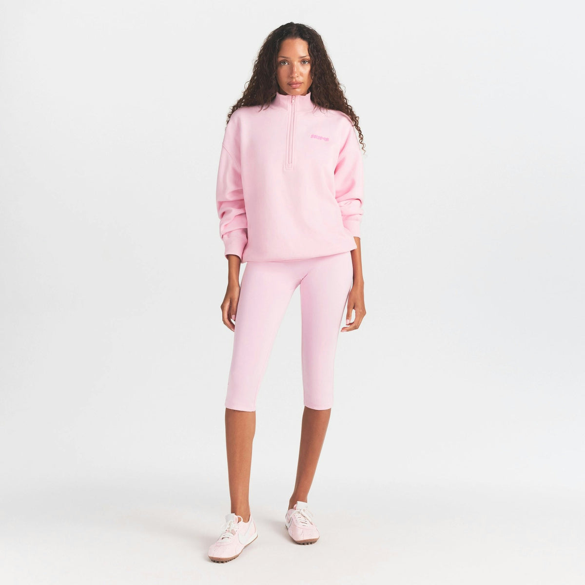 mock neck quarter zip with embossed logo